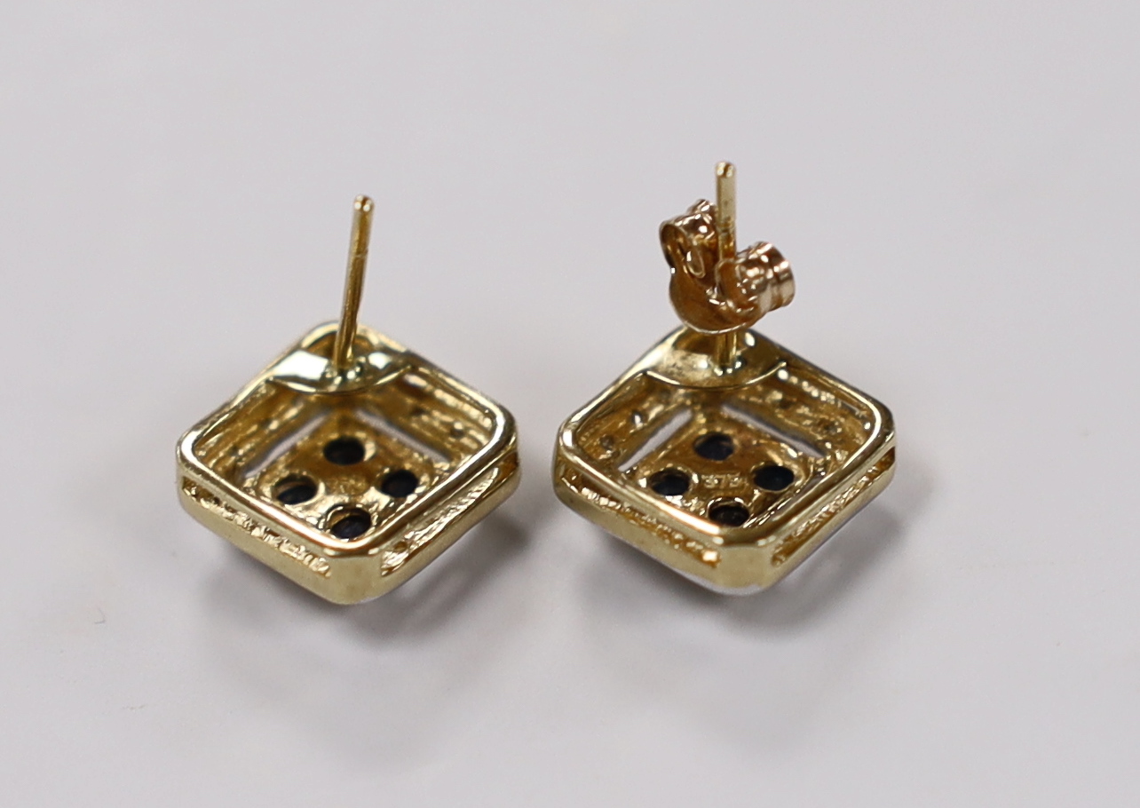 A modern pair of 375 yellow metal, sapphire and diamond chip set square cluster earrings, one butterfly missing, 10mm, gross weight 2.4 grams.